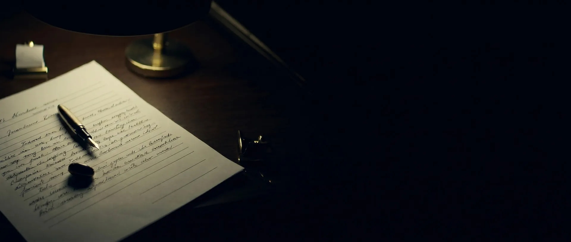 Florida closing paperwork under a brass desk lamp, after hours
